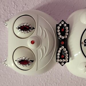 Jeweled White Kit-Cat Klock clock with black bow tie and tail